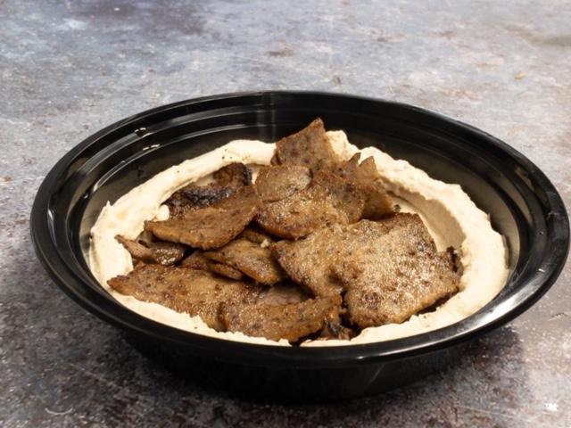 Gyro meat Over Hummus · Mixed Lamb & beef  Over Hummus served with 2 pita