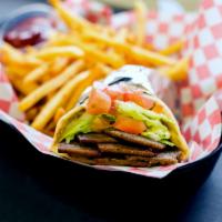 Gyro Sandwich · Combined beef and lamb with special spices and slowly flame-broiled on pita bread with tahin...