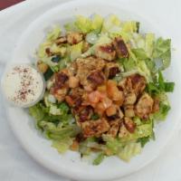 Grilled Chicken Shish Kebob over Salad · White Breast chicken with Barbecue seasoning grilled and served over Mixture of chopped  let...