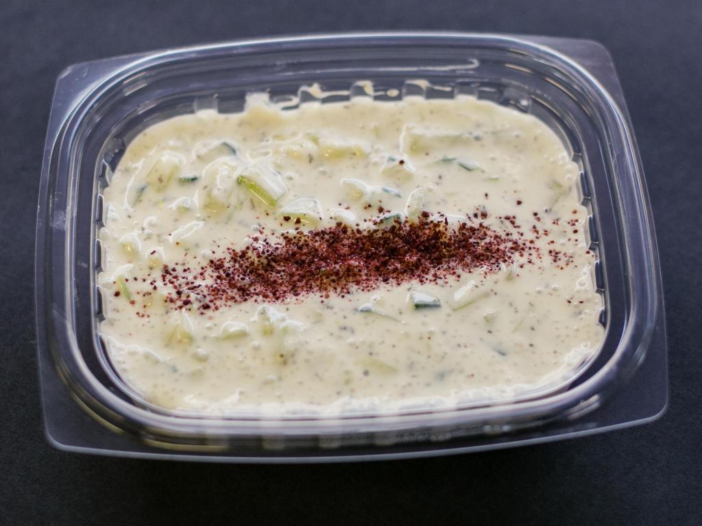 Tzatziki Sauce · Blended cucumber, yogurt, fresh garlic and dry mint.