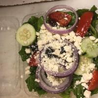 Greek Salad · Romaine lettuce, Greek olives, feta cheese, cucumbers, tomatoes and red onions with a side o...