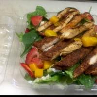 Strawberry Feta Salad · Fresh strawberries, caramelized almonds, feta cheese, slices of mango and grilled chicken, b...