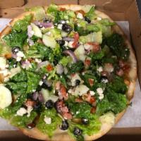 Greek Pie · Romaine lettuce, Greek olives, feta cheese, cucumbers, tomatoes and red onions.
