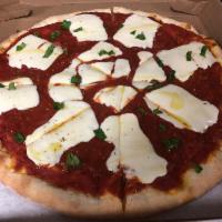 Margherita Pizza · Fresh mozzarella, marinara sauce, fresh garlic, basil and olive oil.