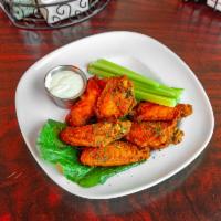 Buffalo Wings · 8 pieces. Served with celery and blue cheese.