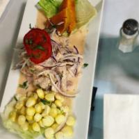 Ceviche de Pescado · Diced fish cooked in lemon juice with onions.
