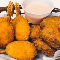 Crab Cakes · 2 pieces. Hand made served with crab claws 2 pieces skewer of deep-fried imitation crab.