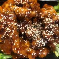 H13. Sesame Beef · Crispy golden tender beef served in mildly season sauce with broccoli and sesame. Hot and sp...