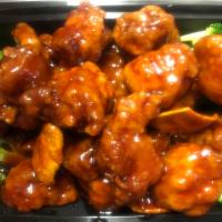 H15. Orange Chicken · Crispy chicken chunks with orange peel in a spicy sauce. Hot and spicy.