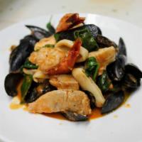 Capellini Pescatore · Cappellini pasta with mussels, clams, calamari, shrimp in a light tomato sauce.