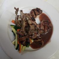 Lamb Chops · Lamb chops grilled to perfection,
 rosemary au jus reduction.
