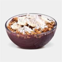 Tropical Acai Bowl · Organic unsweetened açaí, vanilla whey, pineapple, banana. Topped with banana, coconut flake...