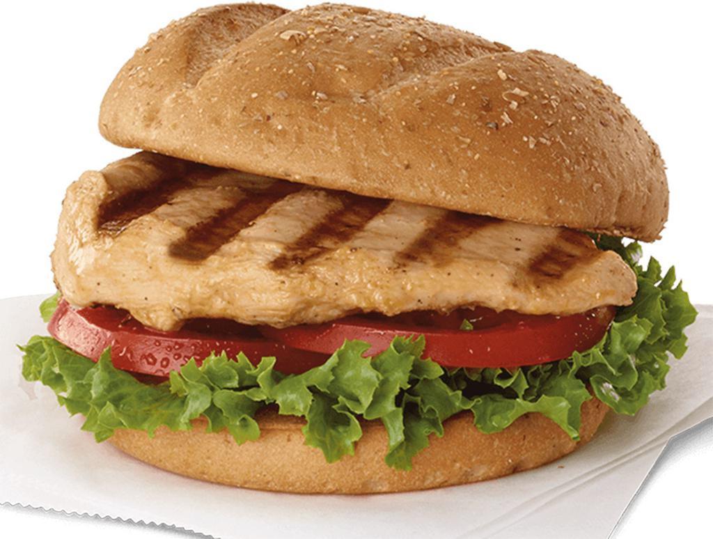 Grilled Chicken Sandwich · Boneless Chicken Marinated  and grilled ,served on a bun with Lettuce Tomatoes and your choice of sauce. 