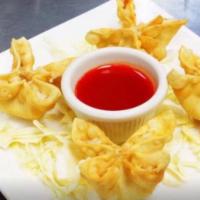 5. Crab Rangoon (6) · Fried wonton wrapper filled with crab and cream cheese.