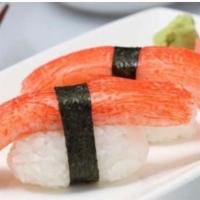 54. Crab Stick Sushi · Seaweed wrapped around rice and filling.