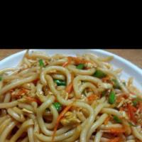 60. Stir-Fried Yaki Udon with Vegetable · Thick wheat flour noodles.