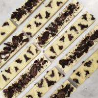 Cookies & Cream Bar · Valrhona Ivoire 35% White Chocolate & Oreo Cookie Pieces. 1 Bar