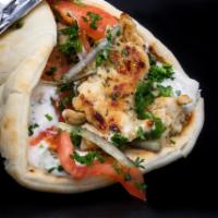 Gyro · Grilled lamb or grilled chicken served in a Greek pita with tzatziki, onion, parsley, and to...