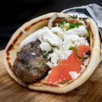 Super Kafta · Seasoned ground beef, made daily, grilled and served on warm pita with baba ganouj, parsley,...
