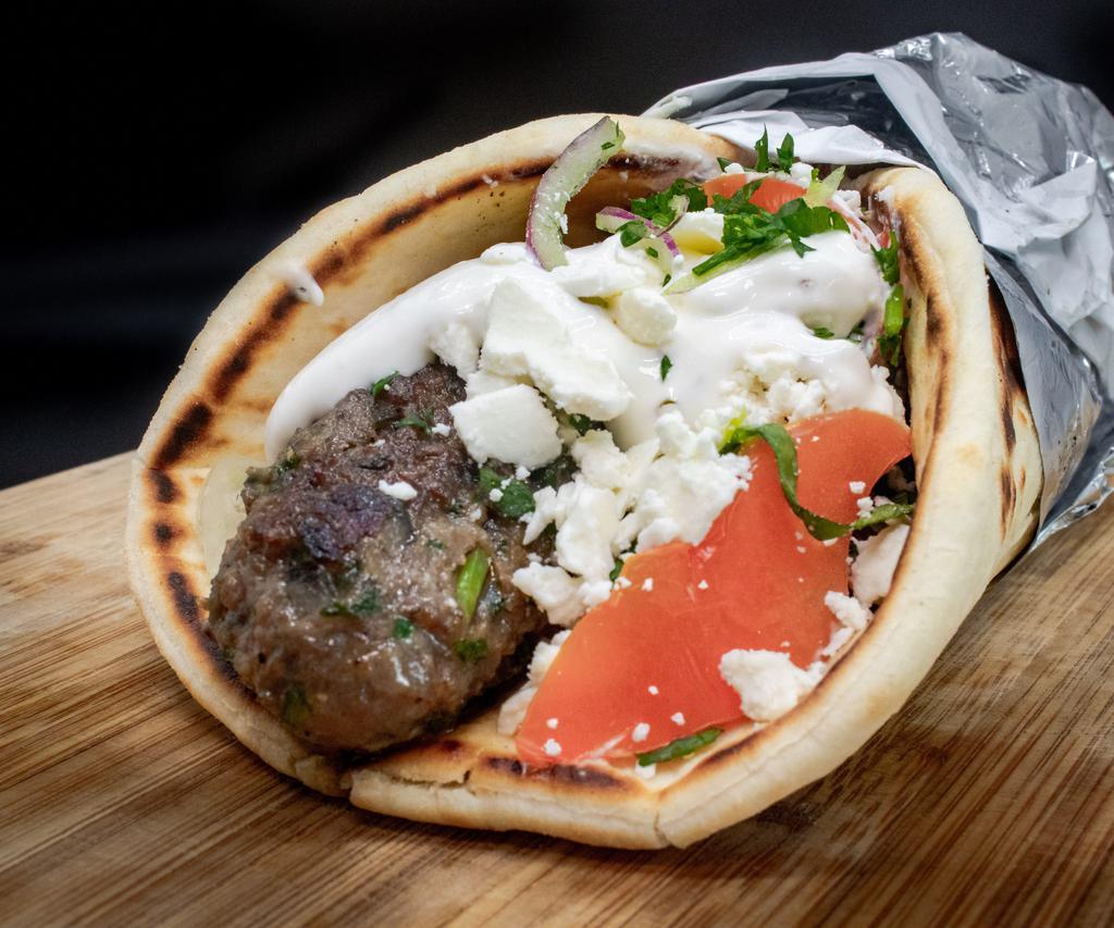 Super Kafta · Seasoned ground beef, made daily, grilled and served on warm pita with baba ganouj, parsley, onion, tomato and choice of house tzatziki or house tahini sauce. Served on a large pita with more meat and comes with feta cheese.