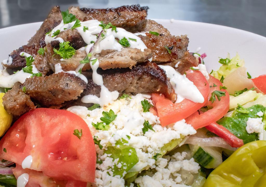 Greek Salad with Grilled Lamb · Romaine lettuce, tomato, onion, red pepper, Greek feta cheese, Kalamata olives, and Dijon vinaigrette served with grilled lamb