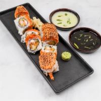 Fireworks Roll · Shrimp tempuras, crab, cucumber, torched spicy tuna on top with special sauce.