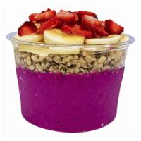 Nutty Pitaya Bowl · Organic pitaya, almond butter, strawberries, banana and housemade cashew milk. Toppings: hem...