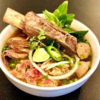 16. Yummy Pho Dish · Beef noodle soup with short rib, filet mignon well done flank, fatty brisket, soft tendon wi...