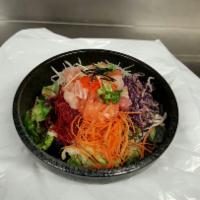 Sashimi over Rice · little pieces of Sashimi and vegetables over rice and sweet and spicy sauce on the side with...