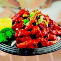 Hana Michi Burning Chicken · Stir-fried burning hot dark chicken from a long bath in a fiery marinade. comes with rice.
