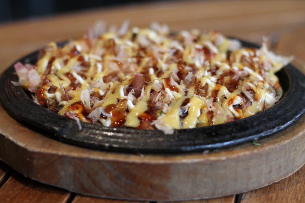 Okonomiyaki Cheese and Seafood · Japanese hot-plate pizza with seafood and mozzarella cheese.