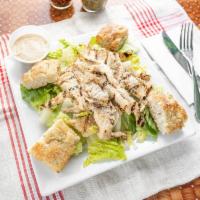 Grilled Chicken Caesar Salads · Green salad with Caesar dressing and cheese. 