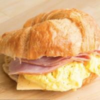 Ham & Eggs & Cheese Breakfast Sandwich · Thinly sliced meat from a pig.'s leg.