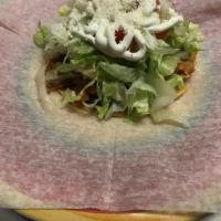 Tostadas · Topped with beans meat of choice,lettuce,tomato,sour cream,white powder cheese.