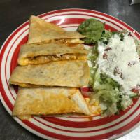 Quesadilla · Inside: meat of choice, flour tortilla  filled with mix cheese served with lettuce,dice toma...