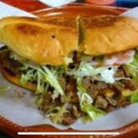 Torta · Crusty white sandwich roll, filled with meat of choice mayo,beans,lettuce,two slice tomatoes...