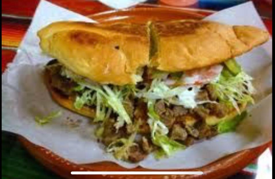 Torta · Crusty white sandwich roll, filled with meat of choice mayo,beans,lettuce,two slice tomatoes, slice of ham,avocado