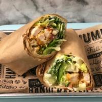 Crispy Chicken Wrap · Crispy chicken, lettuce, tomatoes, red onion, with mayo on a wrap.