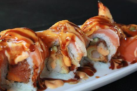 Washington Roll (seared) · In: spicy tuna, cucumber, shrimp tempura. 
Out: salmon, onion, spicy mayo, eel sauce.