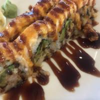Salmon Heights Roll · Baked. In: shrimp tempura, avocado, crunchy flour. 
Out: salmon baked with spicy mayo, eel s...