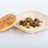 Hummus with ground beef · Grilled chopped beef kabob, tahini sauce, and herbed chickpea mix