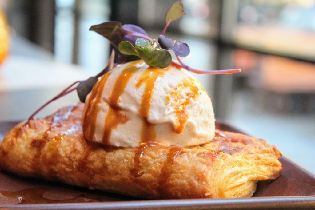 Apple Pie Pastelito · Pink Lady Apples, Vanilla Custard, Cinnamon Spiced Syrup, Coconut Cream, Wheat Pastry (nut free, soy free).