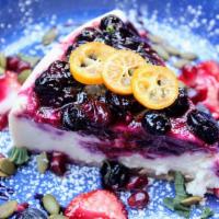 Hibiscus Berry Wine Cheesecake · Hibiscus flowers red wine reduction, blueberry lime compote, tofu coconut, graham crust, Mar...