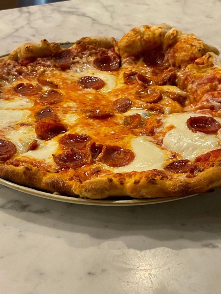 New York-Style Pizza · San Marzano tomato sauce, mozzarella cheese, choice of pepperoni or veggies.