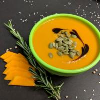 Organic Vegan Pumpkin soup · Pumpkin, potatoes, carrot, and rosemary.