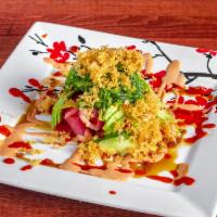 Christmas Tree Salad · Seaweed topped with tuna, salmon, avocado, crispies and specialty sauce.