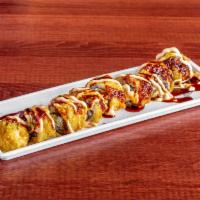 Crabby Roll · Real crab mean, avocado, cream cheese, tempura and topped with chef special sauce.