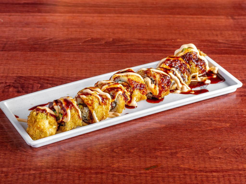 Crabby Roll · Real crab mean, avocado, cream cheese, tempura and topped with chef special sauce.