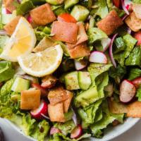 Fattoush Salad	 · Romaine lettuce, tomatoes, cucumbers, onions, mint, sumac, parsley and fried pita, with fres...