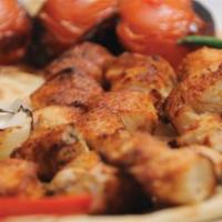 Chicken tekah 	 · Marinated chicken breast. Served with rice, salad & pita bread. 
